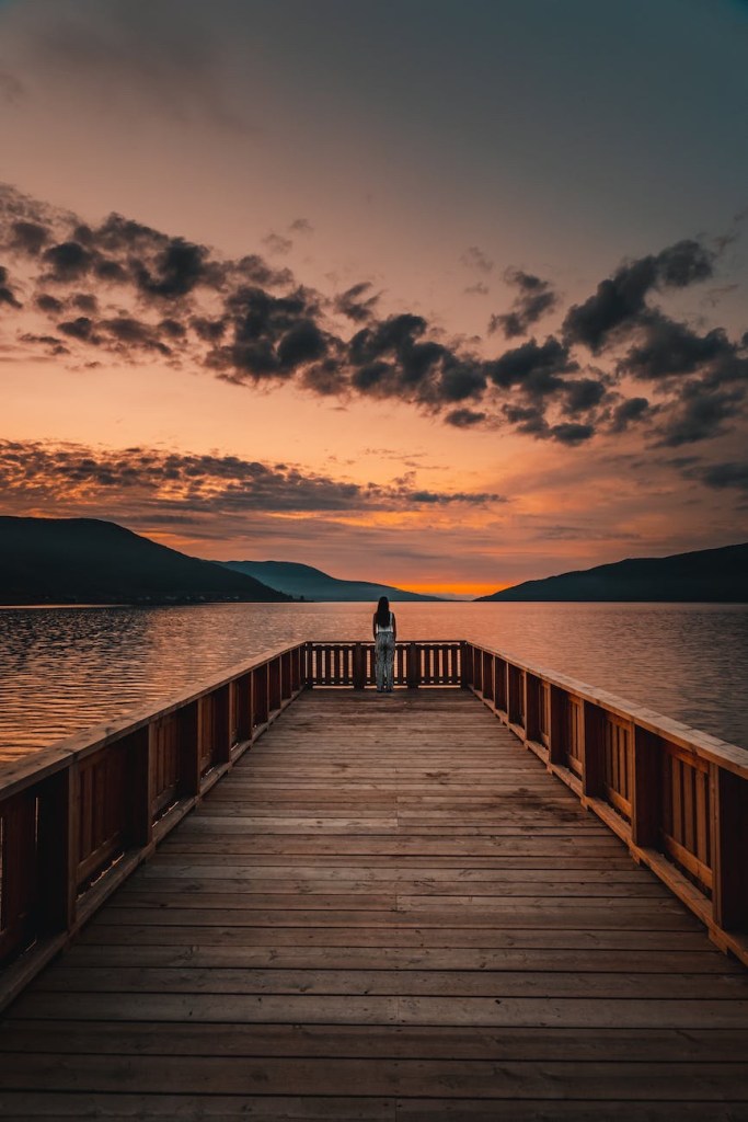 A tranquil spot at sunset on a dock over calm waters