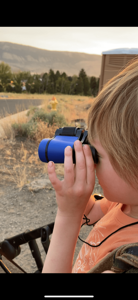 Taken by Alexandra Griffiths: My son on his birthday with his new binoculars.